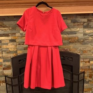 Red dress with attached jacket.